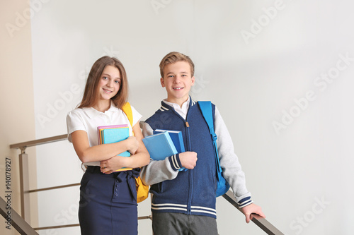 Teenagers with backpacks an...