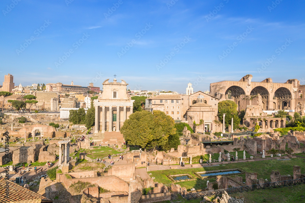 Rome, Italy. Ruins of  Roman Forum: Temple of Deified Julius, Temple of Vesta, House of Vestals, Temple of Antoninus and Faustina,  Temple of Romulus, Basilica of Maxentius