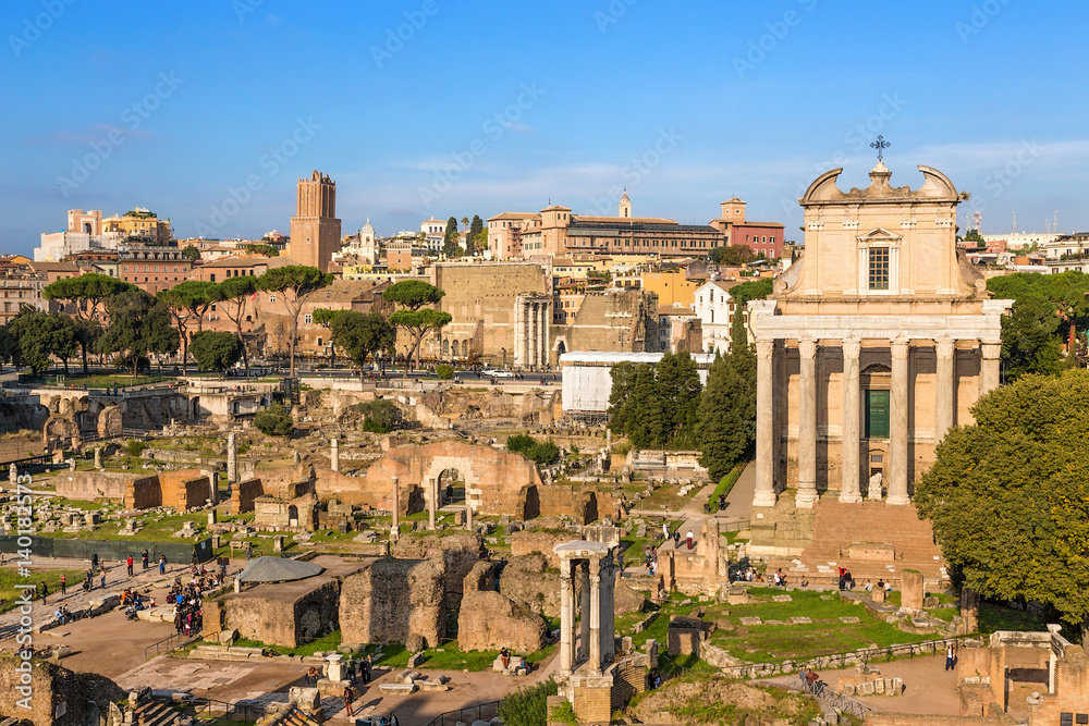 Rome, Italy. Ruins of the Roman Forum: the temple of the Deified Julius, the Temple of Vesta, the Temple of Antoninus and Faustina