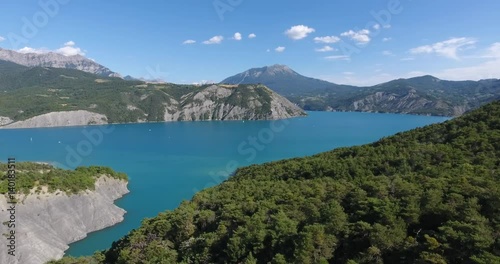 Drone shot lake flying above forest  photo