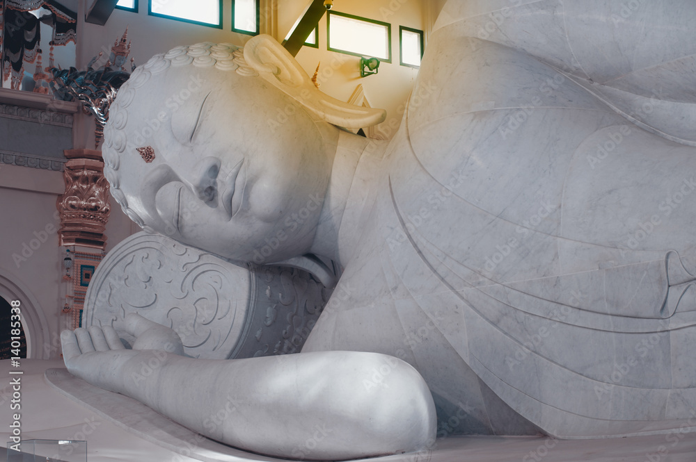 White Reclining Buddha in Wat Pa Phu Kon,Northeastern of Thailand.
