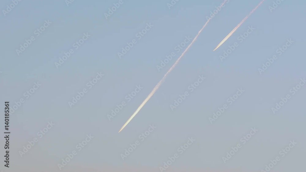 Two airplanes in the evening sky Two airplanes in the evening sky