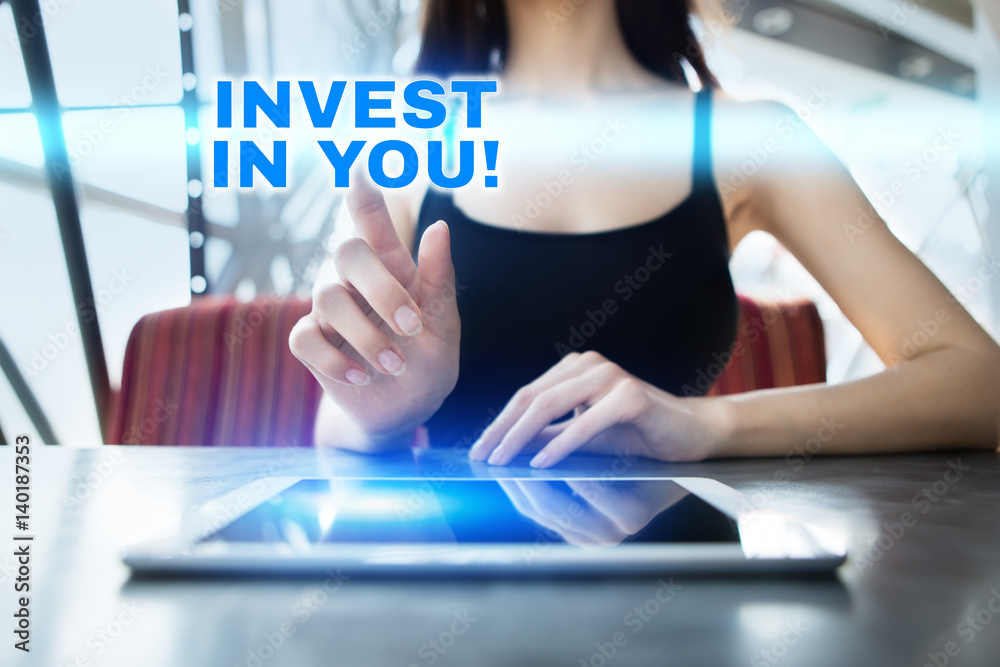 Woman is using tablet pc, pressing on virtual screen and selecting invest in you!. Woman is using tablet pc, pressing on virtual screen and selecting invest in you!.