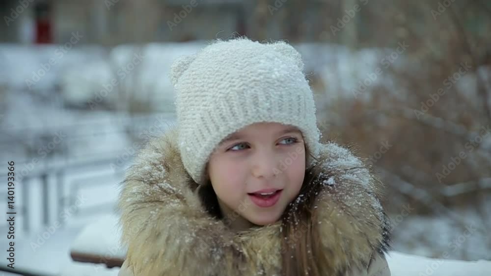 Small girl snowfall slow motion Small girl snowfall slow motion