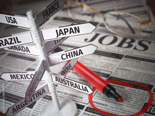 Work and travel immigration opportunity concept. Search for a job. Newspaper with jobs advertisement and signboard with names of countries.