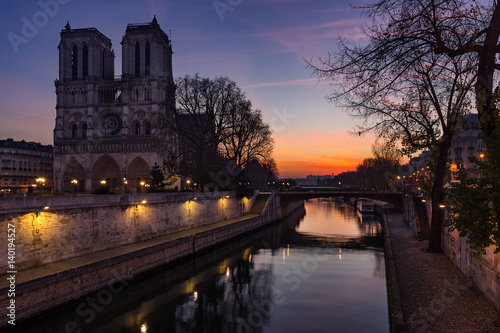 Notre Dame de Paris cathedral at sunrise with the Seine River. Ile de La Cite. 4th Arrondissement, Paris, France