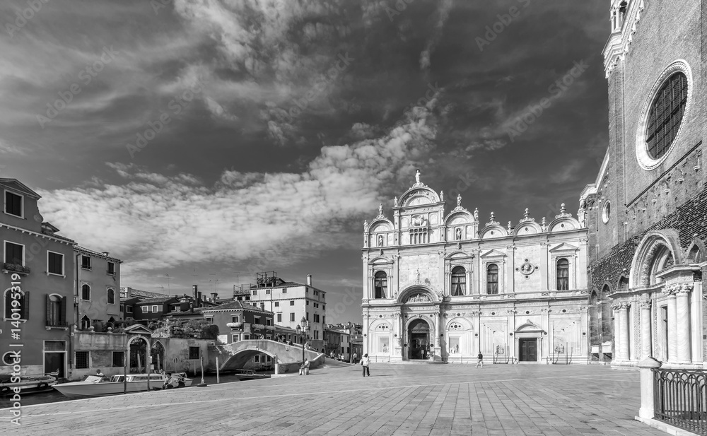 The beautiful Venetian square called Campo Santi Giovanni e Paolo, Venice, Italy, with the facade of the Basilica San Zanipolo, in black and white