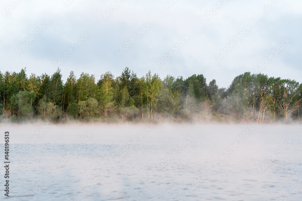 Fototapeta premium Morning fog on the lake, sunrise shot