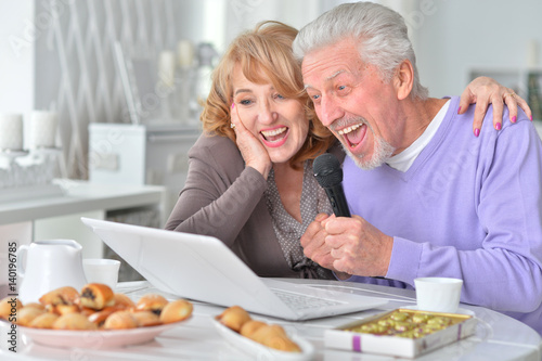 Beautiful elderly couple having breakfast 