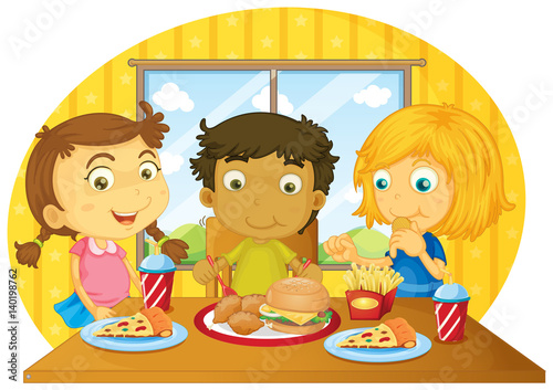 Three kids having meal on table