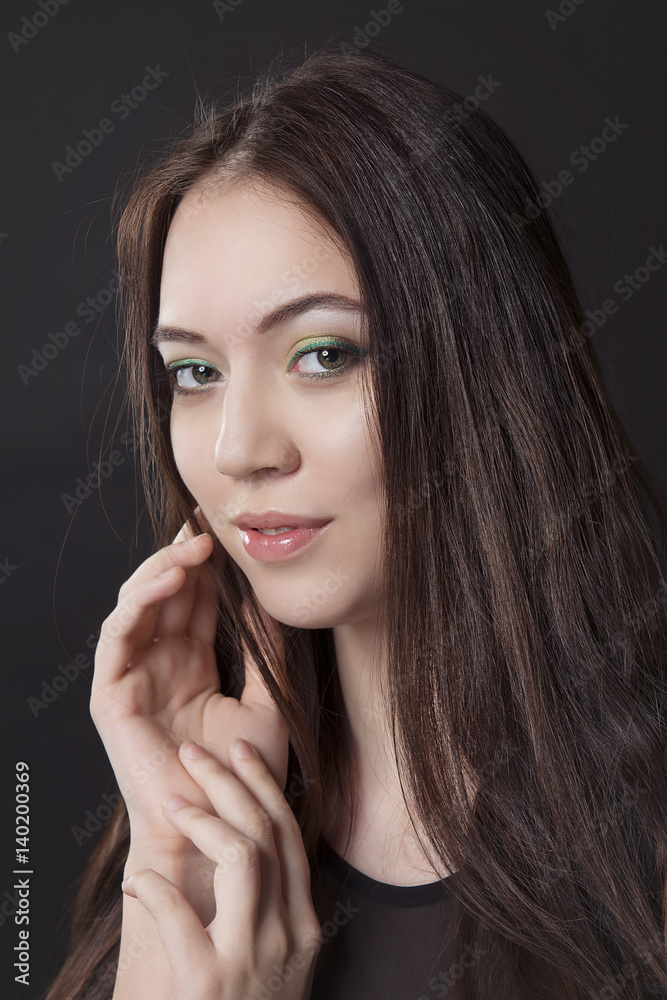 close-up portrait of girl with cocktail makeup on a black isolated background close-up portrait of girl with cocktail makeup on a black isolated background