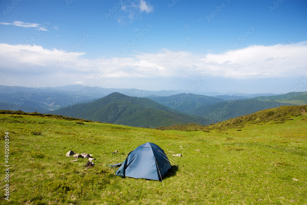 Tourist tent on an Alpine meadow in the Carpathians