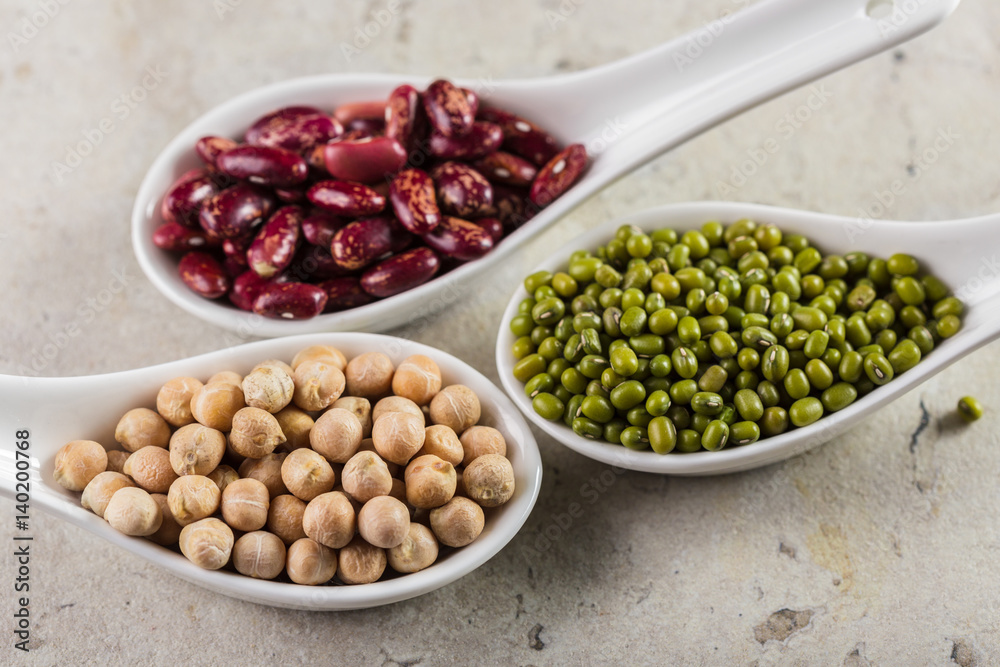 mix of beans on wooden table mix of beans on wooden table