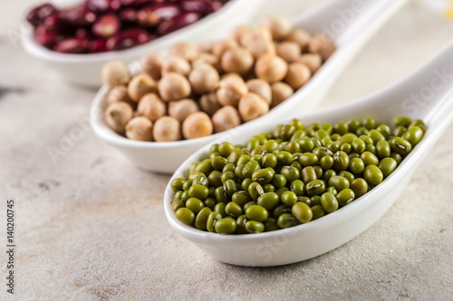 mix of beans on wooden table