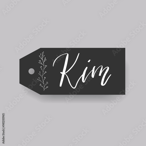 Common female first name Kim on a tag. Hand drawn calligraphy. Wedding typography element.