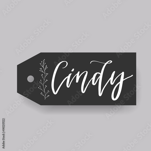 Common female first name Cindy on a tag. Hand drawn calligraphy. Wedding typography element.