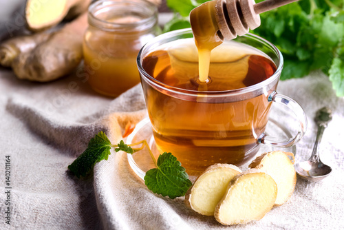Cup with black tea Fresh mint Honey Ginger