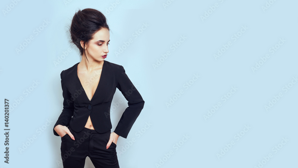 Sexy slim brunette woman posing in studio wearing fashionable jacket Sexy slim brunette woman posing in studio wearing fashionable jacket