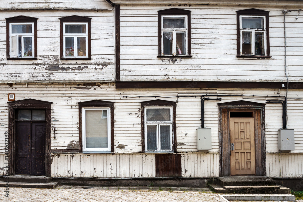 Old white wall with some windows Old white wall with some windows