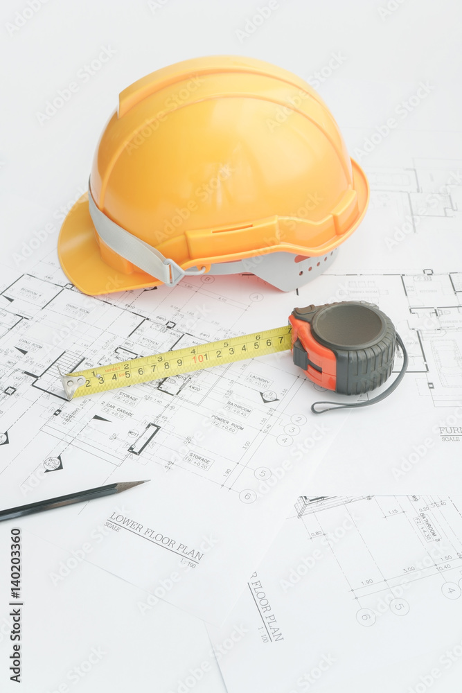 Architects workplace - architectural tools, blueprints, helmet, measuring tape, Construction concept. Engineering tools. Top view Architects workplace - architectural tools, blueprints, helmet, measuring tape, Construction concept. Engineering tools. Top view