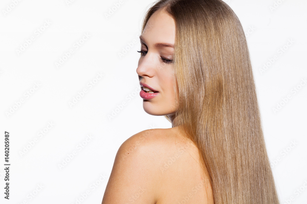 Young blonde model woman with long shiny hair white background Young blonde model woman with long shiny hair white background