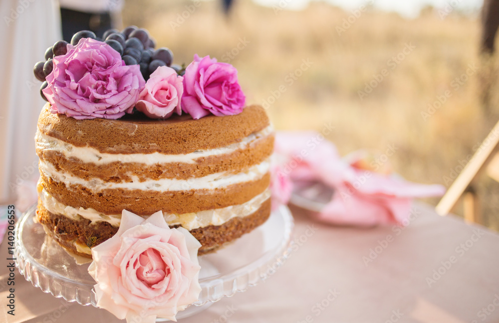 Wedding cake decorated with roses Wedding cake decorated with roses
