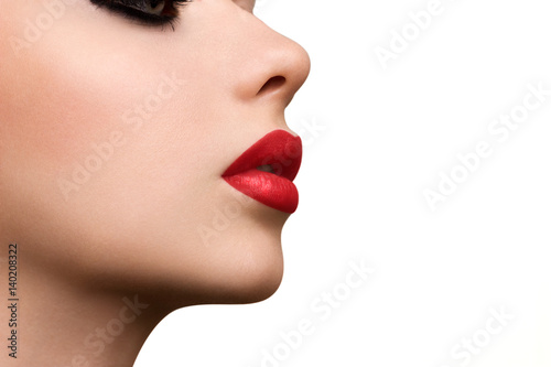 High fashion look.glamor closeup portrait of beautiful sexy stylish Caucasian young woman model with bright makeup, with red lips, with perfect clean skin
