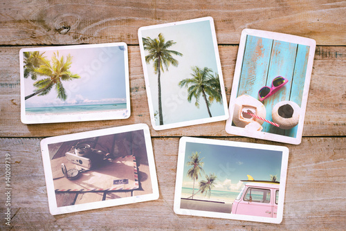 Summer photo album on wood table. Photography from beach vacation - vintage p...