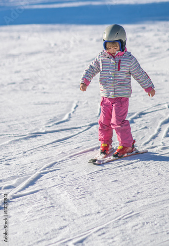 Little girl skiing for the first time