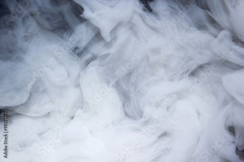 Close up real swirling white smoke background texture / Abstrack photography