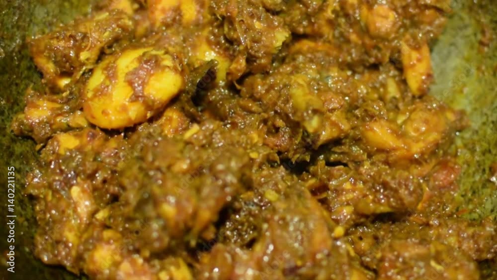 Preparation of smoking hot chicken curry, one of the spicy delicacies of Indian foods. India is famous for such colorful tasty foods for long time. Preparation of smoking hot chicken curry, one of the spicy delicacies of Indian foods. India is famous for such colorful tasty foods for long time.