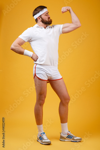 Canvas Print Vertical image of retro sportsman showing bicep