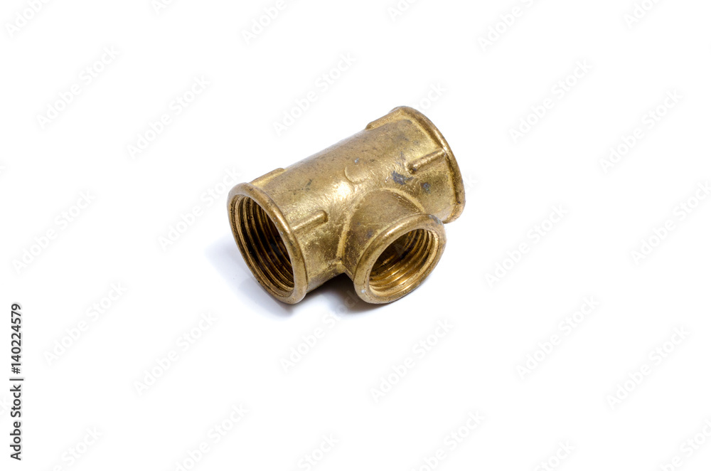 Brass tubing tee for plumbing with carving on white background Brass tubing tee for plumbing with carving on white background