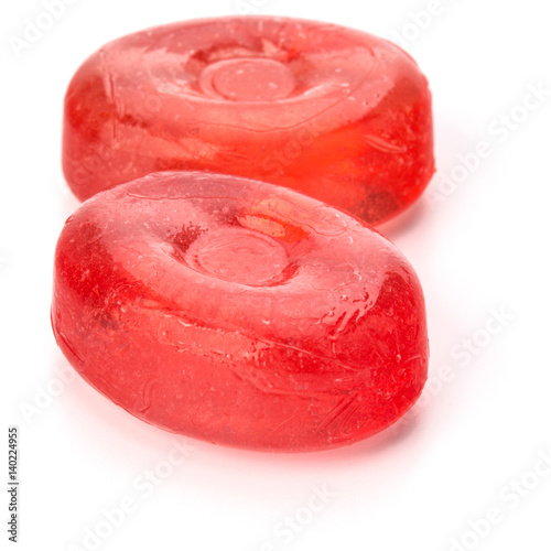 Two colorful fruit hard sugar candies, boiled sweeties or sugar plums isolated on white background cutout