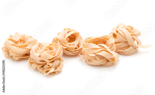 Italian pasta fettuccine nest isolated on white background cutout