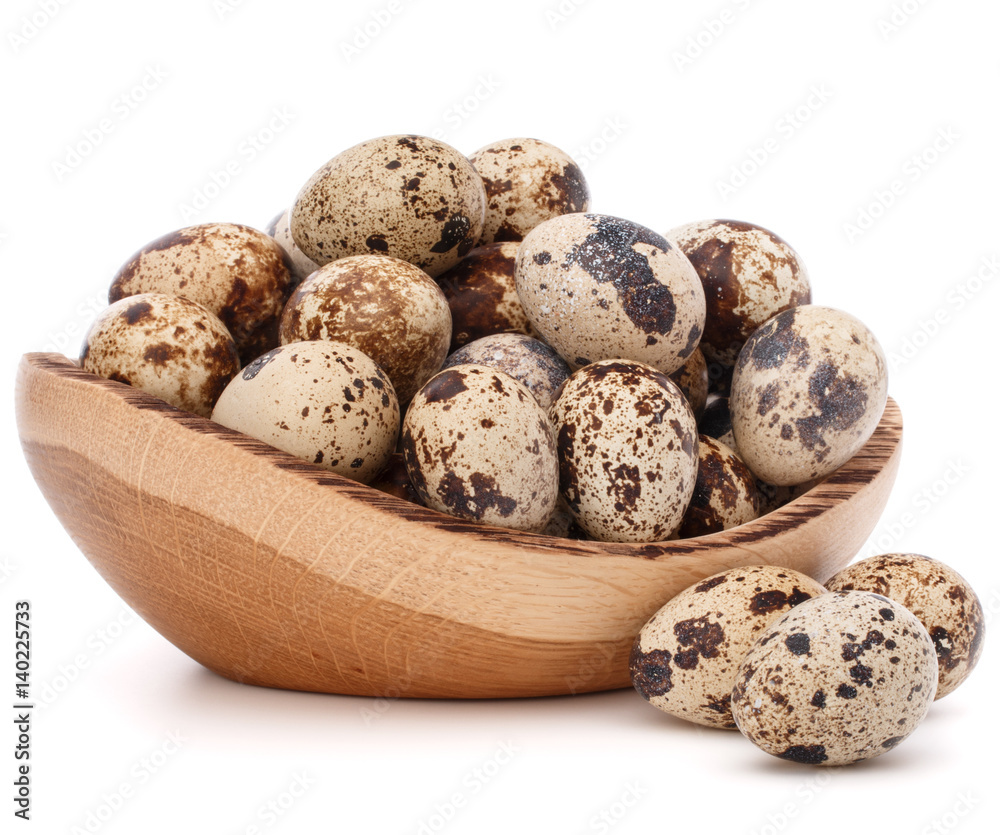 quail eggs in wooden bowl isolated on white background cutout quail eggs in wooden bowl isolated on white background cutout