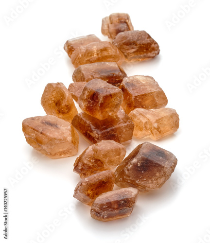 Brown caramelized lump cane sugar cube isolated on white background cutout