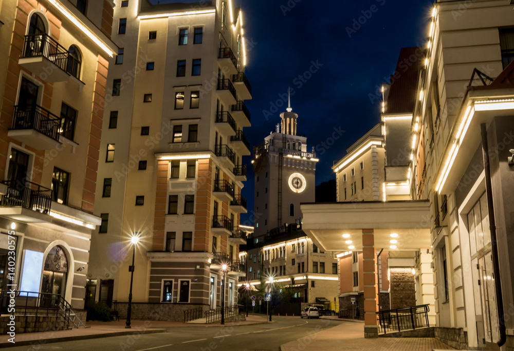 night view of the streets of Krasnaya Polyana near Sochi, Russia. Buildings with backlight