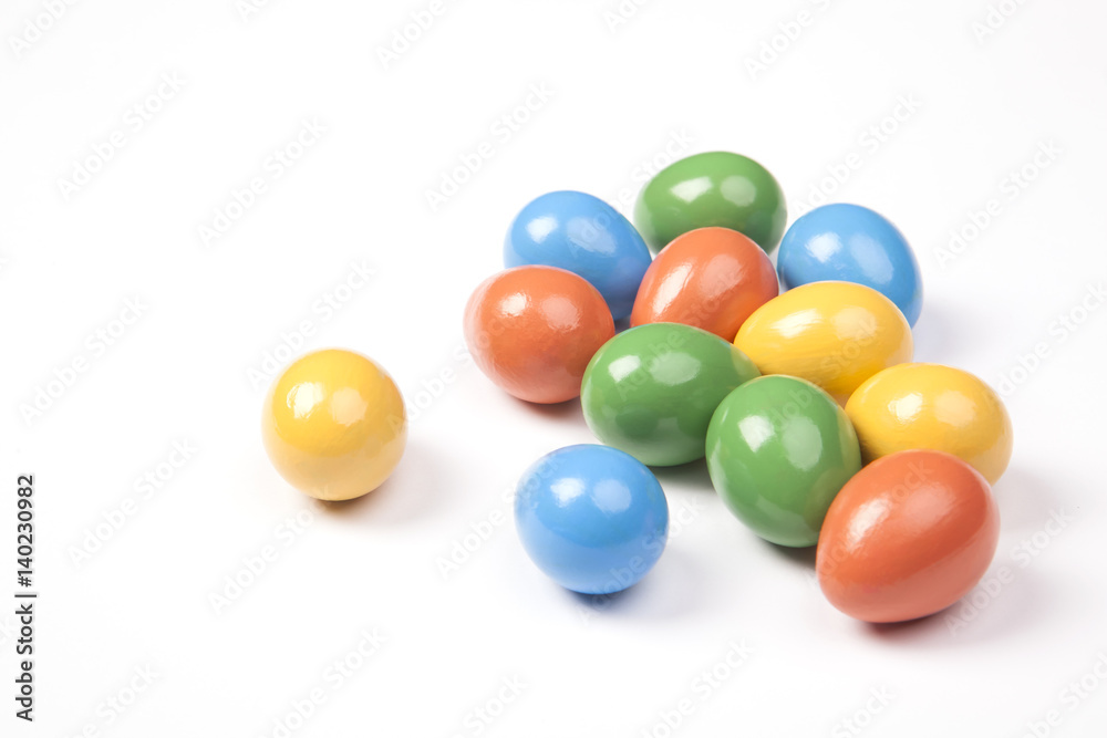 Colored Easter eggs on a white background. Green, red, yellow and blue colors. Colored Easter eggs on a white background. Green, red, yellow and blue colors.