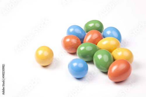 Colored Easter eggs on a white background. Green, red, yellow and blue colors.