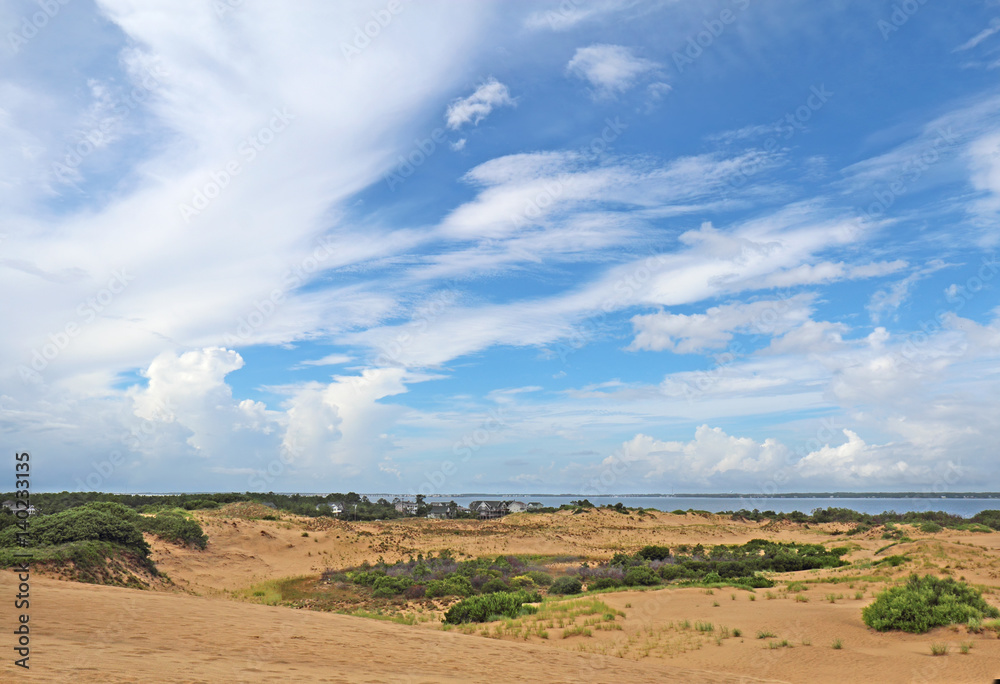Dramatc clouds and sand dunes viewed from Jockeys Ridge State Park, Nags Head, NC