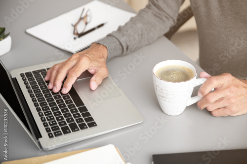 Man working with laptop in room