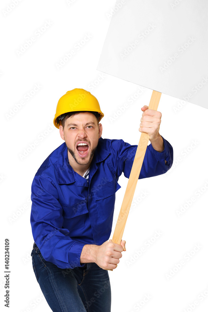 Protesting young man holding placard with space for text on light background Protesting young man holding placard with space for text on light background