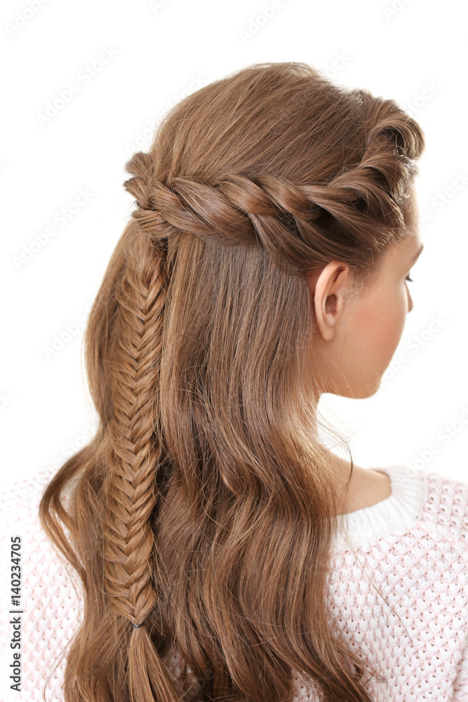 Naklejka premium Young beautiful woman with nice braid hairstyle on white background