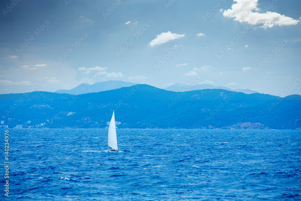 Naklejka premium photo of beautiful ship in the sea on the wonderful mountains background in Greece