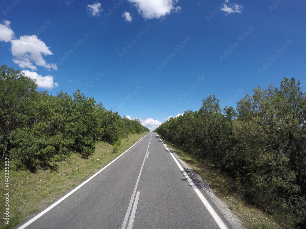 photo of beautiful road on the sunny sky background in Greece