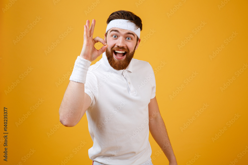 Happy sportsman showing ok sign Happy sportsman showing ok sign