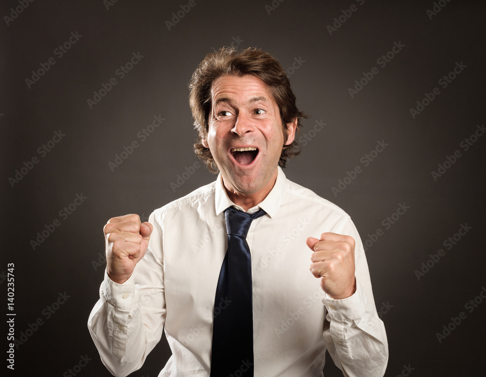 portrait of a businessman celebrating being a winner