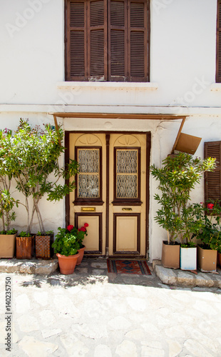 photo of beautiful door of one of the buildings in sunny Greece