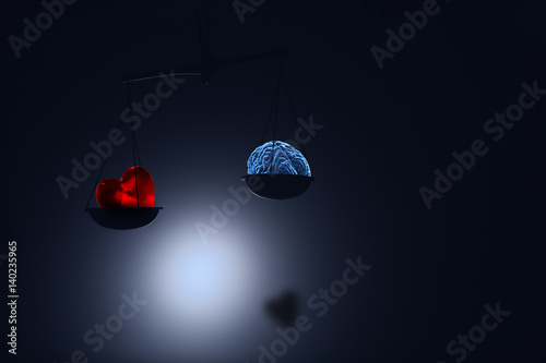 red heart and brain on on scale